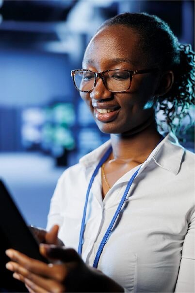 IT tech professional looking at a device